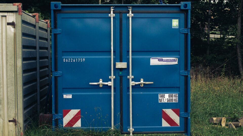 A couple of blue containers sitting next to each other